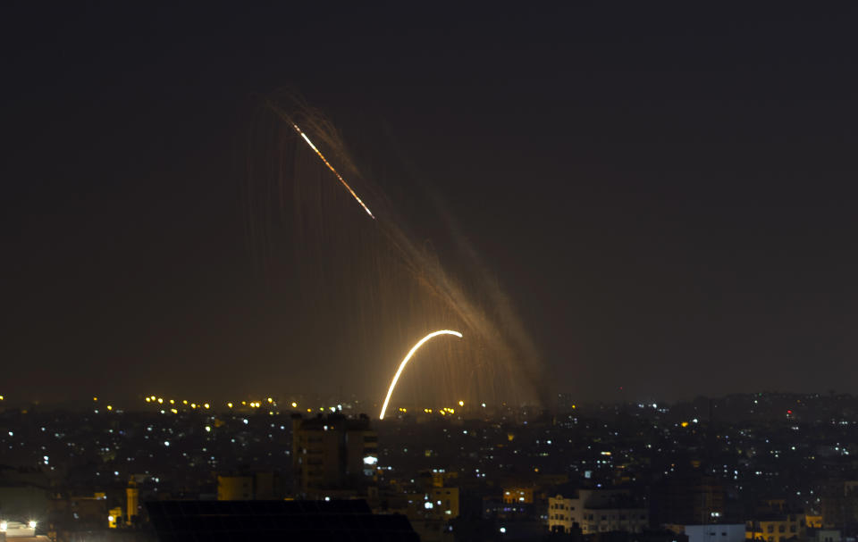 Rockets are launched from the Gaza Strip towards Israel, Wednesday, Nov. 13, 2019. (AP Photo/Khalil Hamra)