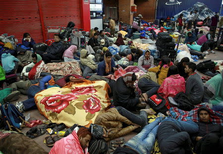 People wait outside the departure terminal at the airport in Kathmandu, Nepal, April 27, 2015, following the April 25 earthquake. REUTERS/Danish Siddiqui