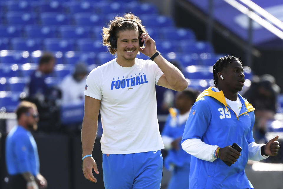 Los Angeles Chargers quarterback Justin Herbert looks on during pre-game warm-ups before an NFL football game against the Baltimore Ravens, Sunday, Oct. 17, 2021, in Baltimore, Md. (AP Photo/Terrance Williams)