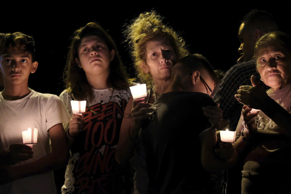 From left, Christopher Rodriguez, Esmeralda Rodriguez, Mona Rodriguez, Jayanthony Hernandez, 12, and Juanita Rodriguez participate in a candlelight vigil for the victims of a fatal shooting at the First Baptist Church in Sutherland Springs, Texas, on Sunday, Nov. 5, 2017. (Photo: Laura Skelding/AP)