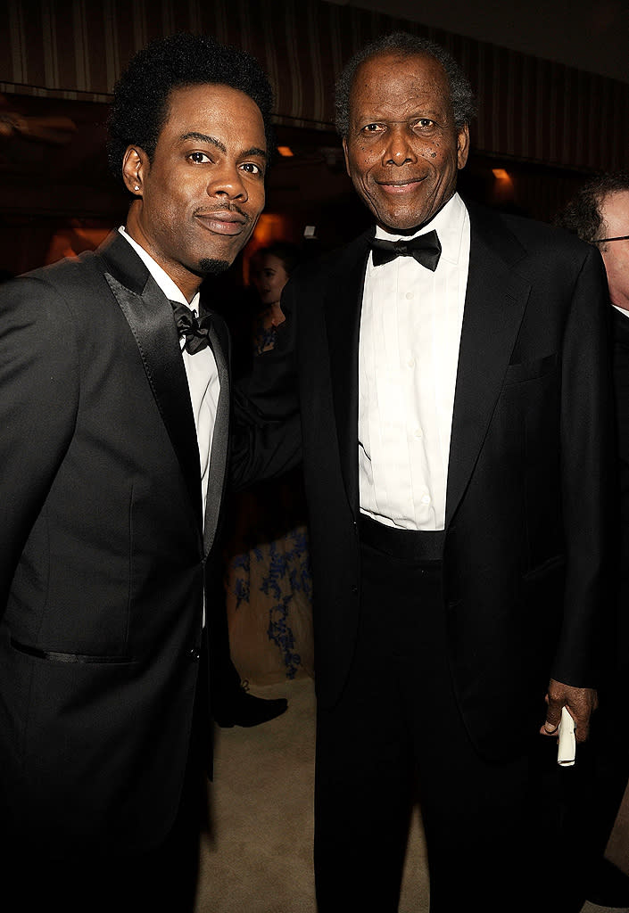 Comedian Chris Rock caught up with his pal, 85-year-old Oscar winner Sidney Poitier ("Lilies of the Field"), who looked sharp in his tux.