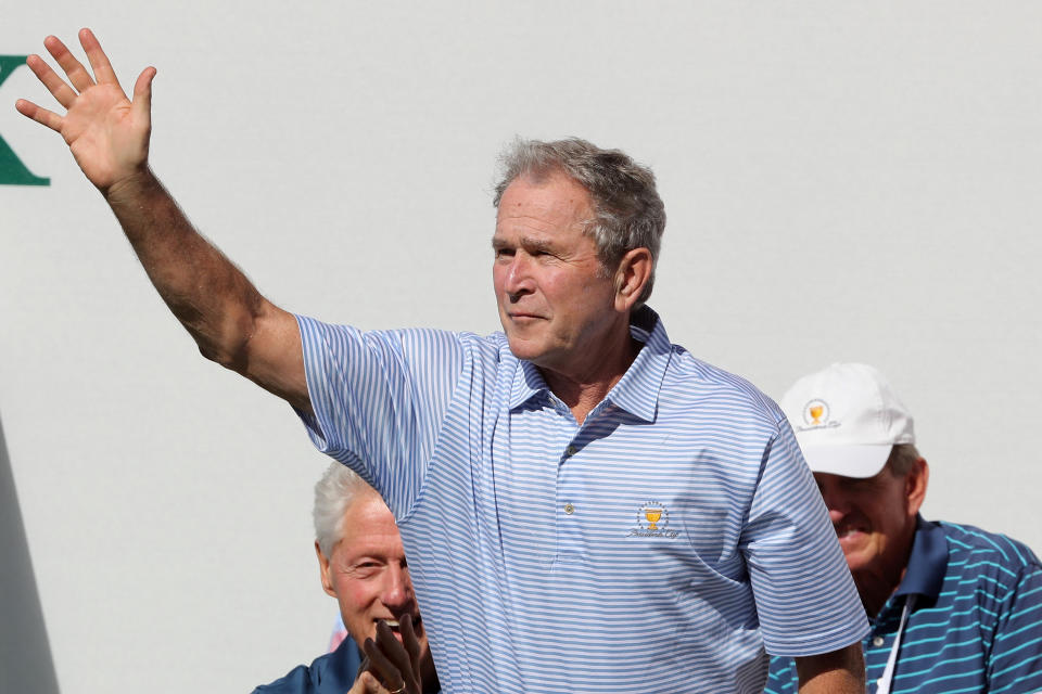 <p>Former U.S. President George W. Bush waves to the crowd prior to Thursday foursome matches of the Presidents Cup at Liberty National Golf Club on Sept. 28, 2017 in Jersey City, N.J. (Photo: Sam Greenwood/Getty Images) </p>