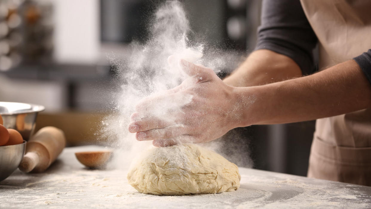 baker making bread from scratch