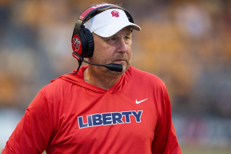 Liberty coach Hugh Freeze watches during the first half of the team's NCAA college football game against Southern Mississippi in Hattiesburg, Miss., Saturday, Sept. 3, 2022. (Hannah Ruhoff/The Sun Herald via AP)