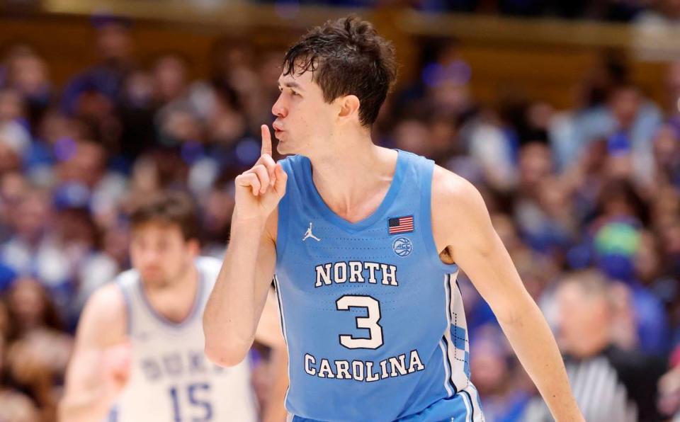 North Carolina’s Cormac Ryan (3) quiets the crowd after hitting a three-pointer during the second half of UNC’s 84-79 victory over Duke at Cameron Indoor Stadium in Durham, N.C., Saturday, March 9, 2024.