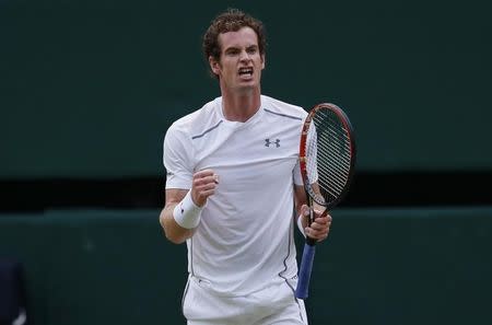 Andy Murray of Britain celebrates after winning his match against Andreas Seppi of Italy at the Wimbledon Tennis Championships in London, July 4, 2015. REUTERS/Suzanne Plunkett