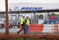 Workers walk through the Boeing South Carolina Plant while voting started on Wednesday whether the plant will be unionized in North Charleston, South Carolina, U.S. February 15, 2017. REUTERS/Randall Hill