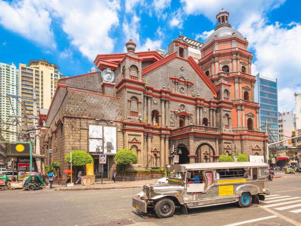 A jeepney in front of the Minor Basilica of Saint Lorenzo Ruiz.