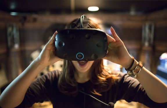 TOKYO, JAPAN - MAY 12: A visitor wearing an HTC Corp. Vive VR headset plays a virtual reality video game at the VR Park Tokyo on May 12, 2017 in Tokyo, Japan. The VR Park Tokyo, a theme park with 7 VR arcade games was opened last year in the Shibuya area of Tokyo, in part, as a response to the growing market for global virtual reality gaming. (Photo by Tomohiro Ohsumi/Getty Images)