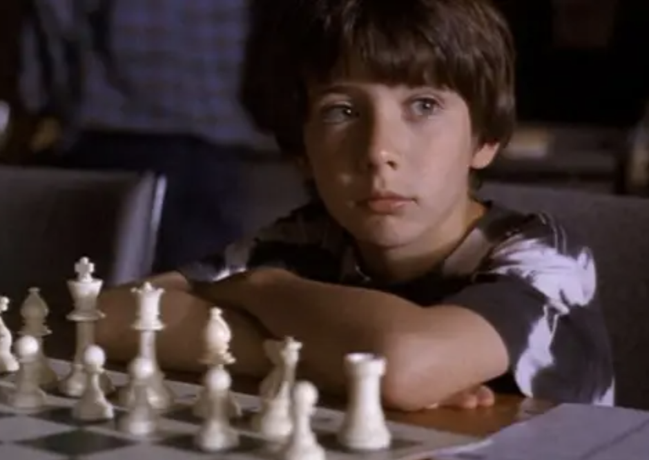 Pomeranc sits in front of a chessboard in the film