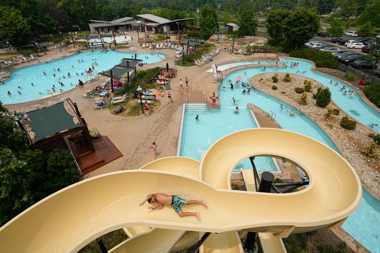 Kids and families play at Highlands Park Aquatic Center in Westerville on June 7. The pool features a lazy river and large water slide, but carries a $20 admission price for nonresidents.