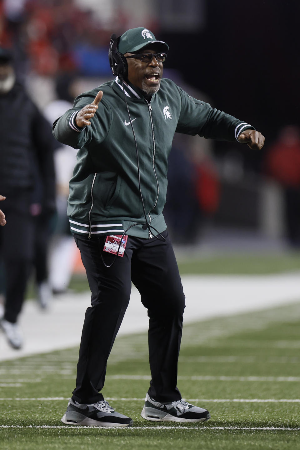 Michigan State interim coach Harlon Barnett shouts to players during the second half of the team's NCAA college football game against Ohio State on Saturday, Nov. 11, 2023, in Columbus, Ohio. (AP Photo/Jay LaPrete)