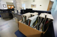 Unused patient chart folders are boxed up in the Alliance Healthcare System hospital in Holly Springs, Miss., as photographed Feb. 29, 2024. The hospital was required to close all inpatient beds and provide 24/7 emergency care as a rural emergency hospital. (AP Photo/Rogelio V. Solis)