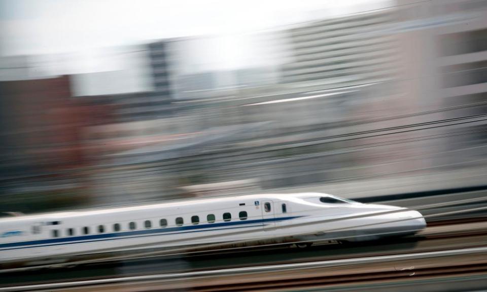 A bullet train streaks through the station of Hamamatsu