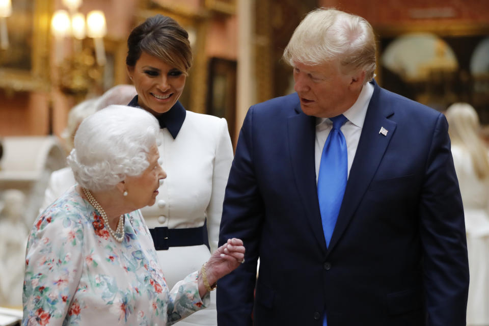 Image of Britain's Queen Elizabeth speaking to U.S President Donald Trump and First Lady Melania Trump represents album stolen in Buckingham Palace burglary 