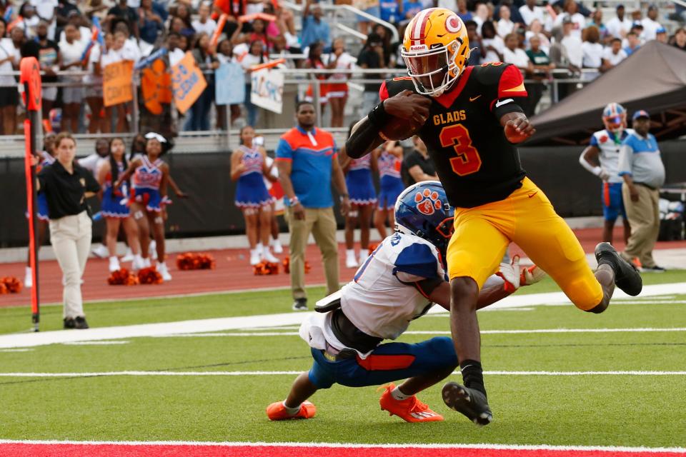 Clarke Central's Lucian Anderson III (3) drives in for the first touchdown of the game during a GHSA high school football between Cedar Shoals and Clarke Central in Athens, Ga., on Thursday, Aug. 18, 2022.