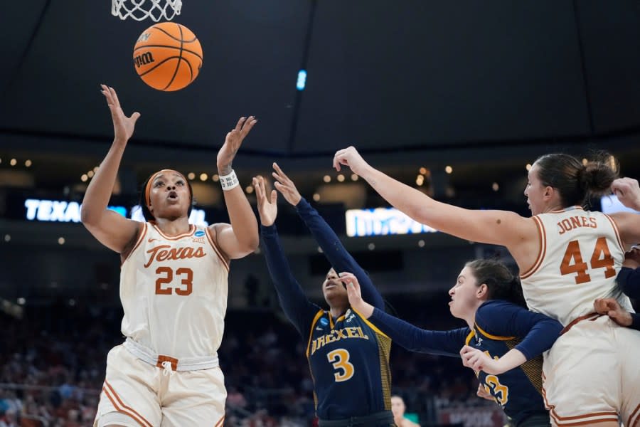 Texas forward Aaliyah Moore (23) reaches for a rebound ahead of Drexel guard Amaris Baker (3) during the first half of a first-round college basketball game in the women’s NCAA Tournament in Austin, Texas, Friday, March 22, 2024. (AP Photo/Eric Gay)