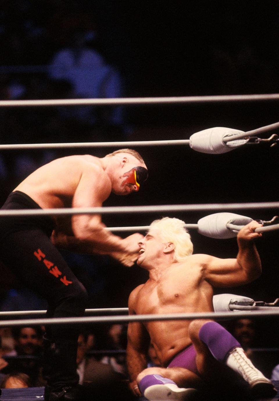 <p>Road Warrior Hawk punches the “Nature Boy” Rick Flair in the corner during their Heavy Weight bout at the 1988 Bunkhouse Stampede on January 24, 1988 at the Nassau Coliseum in Uniondale, New York. (Photo by B Bennett/Getty Images) </p>