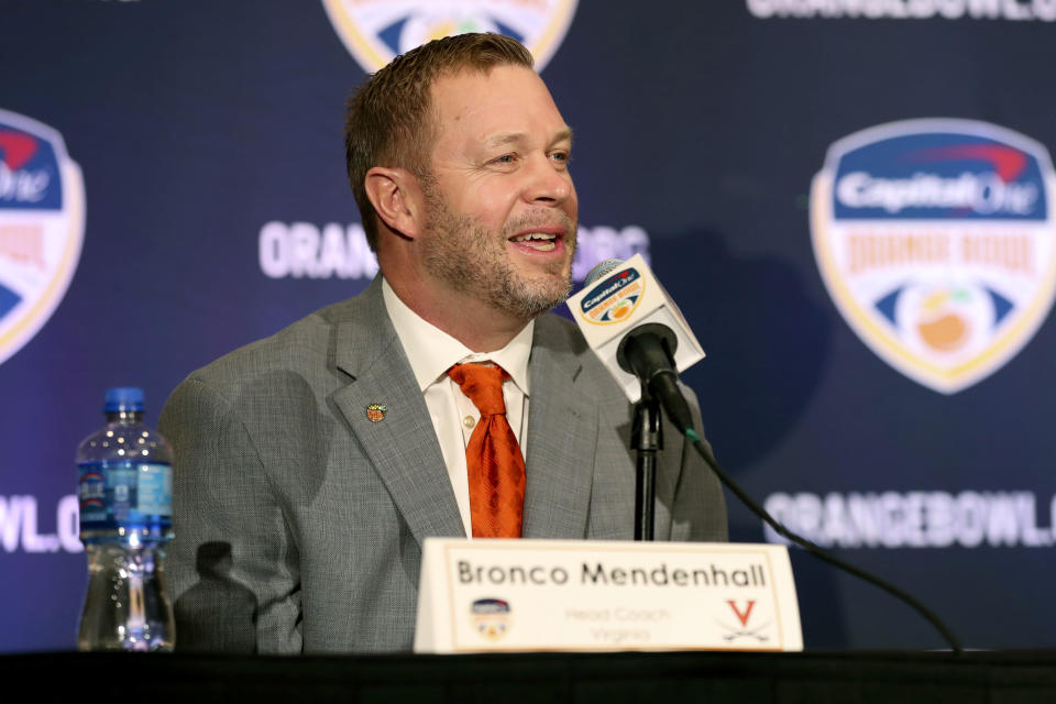 Virginia Cavaliers head coach Bronco Mendenhall speaks during a news conference for the Orange Bowl NCAA college football game, Sunday, Dec. 29, 2019, in Fort Lauderdale, Fla. Florida plays Virginia in the Orange Bowl on Dec. 30. (AP Photo/Mario Houben)