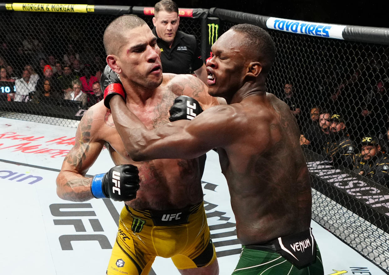 NEW YORK, NEW YORK - NOVEMBER 12: (L-R) Alex Pereira of Brazil punches Israel Adesanya of Nigeria in the UFC middleweight championship bout during the UFC 281 event at Madison Square Garden on November 12, 2022 in New York City. (Photo by Jeff Bottari/Zuffa LLC)