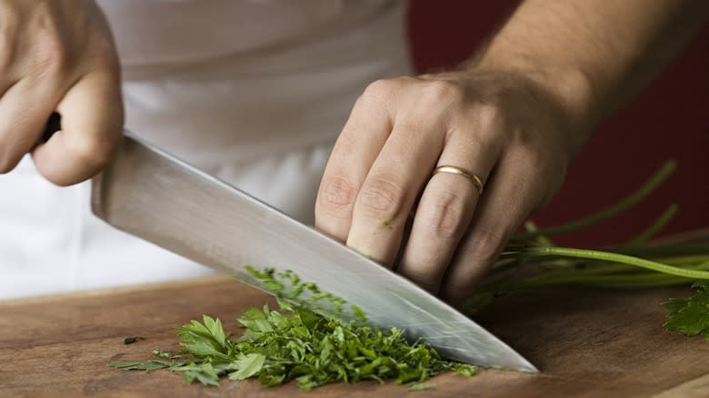Person chopping herbs