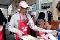 Pharrell Williams serves food at The Los Angeles Mission’s Easter event for the homeless on Friday in L.A.