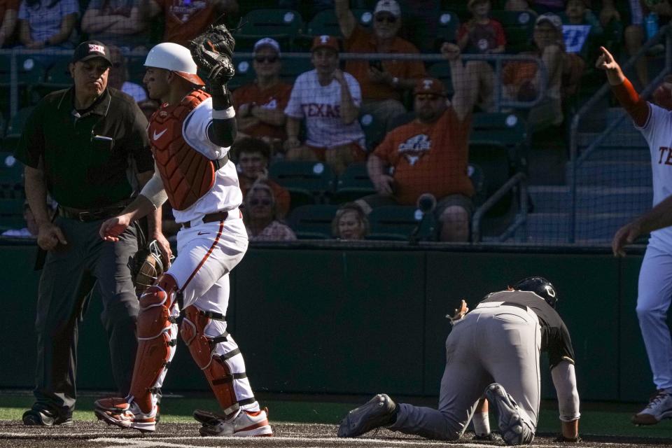 Texas Longhorns catcher Rylan Galvan celebrates tagging out Cal Poly outfielder Jake Steels during the game at UFCU Disch–Falk Field on Sunday. Texas won 7-0 to complete the sweep without allowing a run.