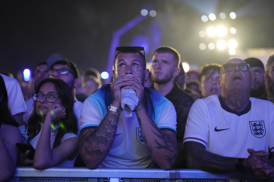 England fans react during the final match between Spain and England at the Euro 2024 soccer tournament, at a fan zone in Berlin, Germany, Sunday, July 14, 2024. (AP Photo/Markus Schreiber)