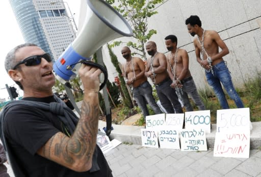 African migrants and Israelis demonstrate in Tel Aviv on April 3, 2018, against an Israeli government plan to forcibly deport African refugees and asylum seekers