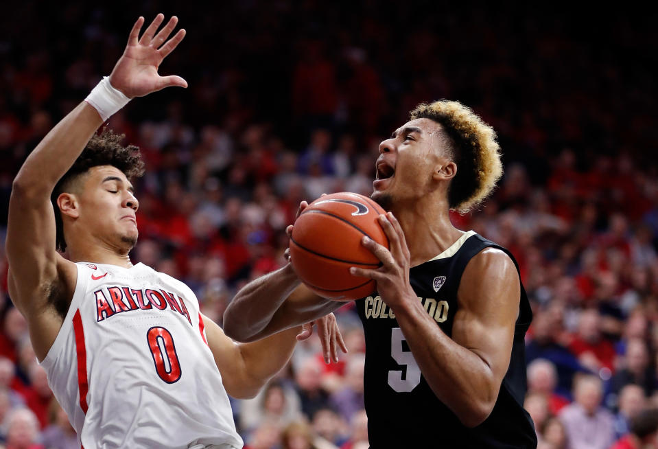 TUCSON, AZ - JANUARY 18: Arizona Wildcats guard Josh Green (0) defends Colorado Buffaloes guard D'Shawn Schwartz (5) during the first half of the college basketball game at McKale Center on January 18, 2020 in Tucson, Arizona. (Photo by Chris Coduto/Icon Sportswire via Getty Images)