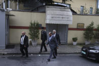 Security guards walk outside Saudi Arabia's Consulate in Istanbul, Monday, Oct. 15, 2018. Turkey and Saudi Arabia are expected to conduct a joint "inspection" on Monday of the consulate, where Saudi journalist Jamal Khashoggi went missing nearly two weeks ago, Turkish authorities said. (AP Photo/Petros Giannakouris)