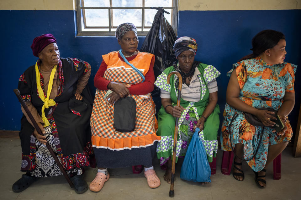 Women wait to cast their ballots on Wednesday May 29, 2024 during general elections in Nkandla, Kwazulu Natal, South Africa. South Africans are voting in an election seen as their country's most important in 30 years, and one that could put them in unknown territory in the short history of their democracy, the three-decade dominance of the African National Congress party being the target of a new generation of discontent in a country of 62 million people — half of whom are estimated to be living in poverty. (AP Photo/Emilio Morenatti)