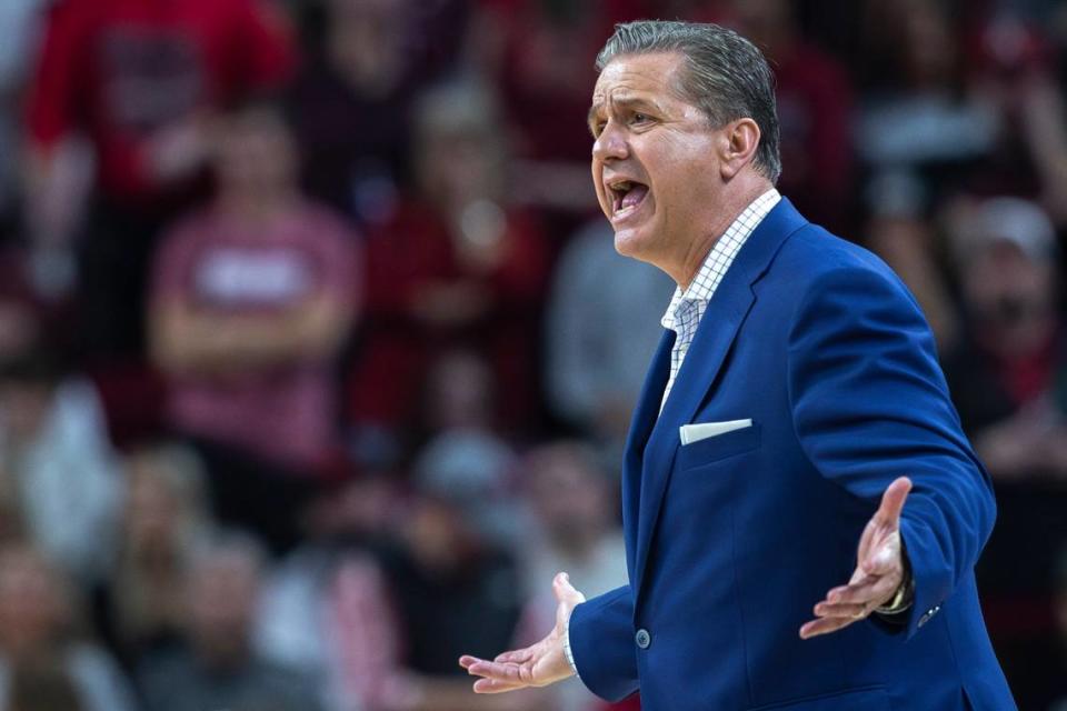 Kentucky head coach John Calipari talks to an official during Saturday’s game at Bud Walton Arena in Fayetteville, Ark.