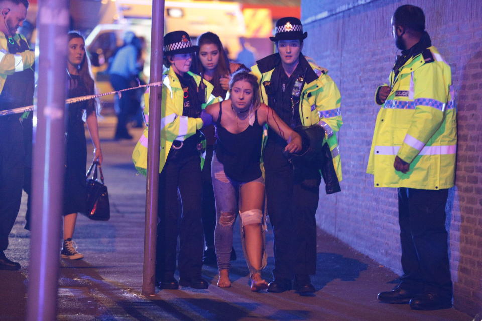 Police and other emergency services assist a victim near the Manchester arena.&nbsp;&nbsp;