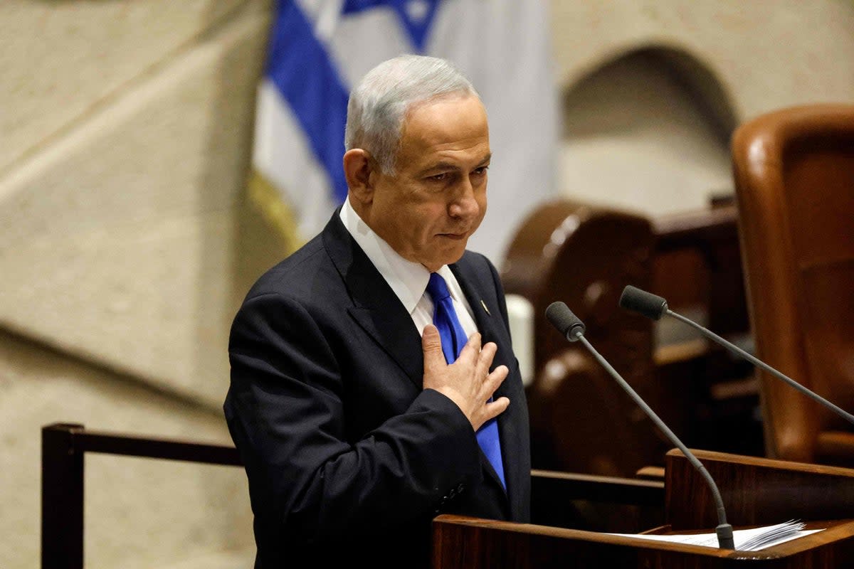 Benjamin Netanyahu presents the new government to parliament at the Knesset  (AFP via Getty Images)