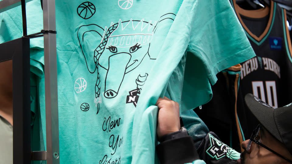 These seafoam green T-shirts are among many Ellie-themed items on sale at the gift shop. - Laura Oliverio/CNN