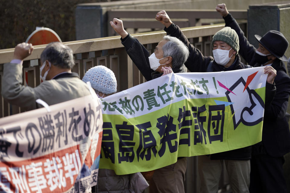 Supporters of the plaintiff protest outside of the Tokyo High Court in Tokyo Wednesday, Jan. 18, 2023. The court on Wednesday found three former executives of Tokyo Electric Power Company not guilty of negligence over the 2011 Fukushima nuclear meltdowns and subsequent deaths of more than 40 elderly residents during their forced evacuation. (AP Photo/Eugene Hoshiko)