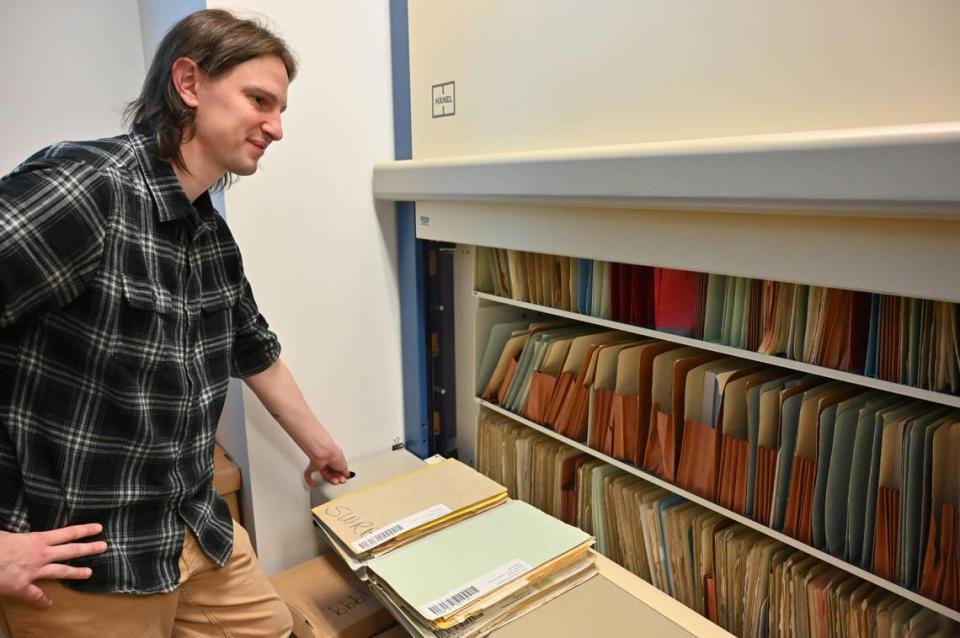 Matthew Jay, a water rights analyst for the State Water Resources Control Board, accesses files in the the water rights records room at the board’s offices in downtown Sacramento in December.