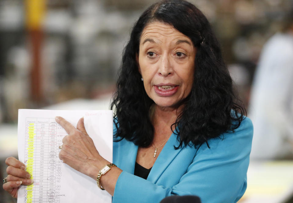 FILE- In this Nov. 15, 2018 file photo, Palm Beach County Supervisor Of Elections Susan Bucher points at a tally sheet in West Palm Beach, Fla. Republican Florida Gov. Ron DeSantis suspended the Bucher on Friday, Jan. 18, 2019, who failed to meet deadlines during recounts after November's election. Her supporters said the move was unwarranted and political. (AP Photo/Wilfredo Lee, File)