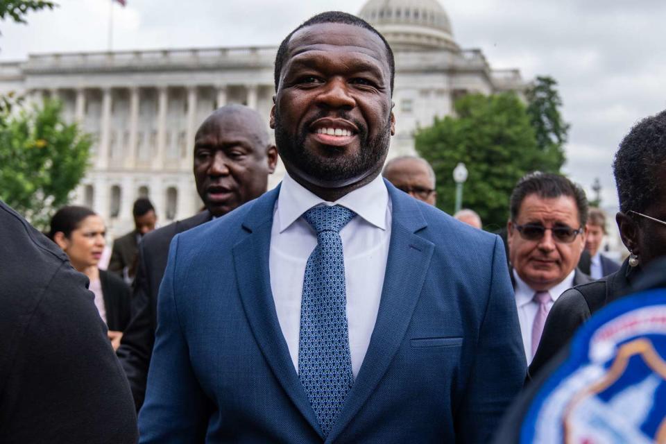 <p>Tom Williams/CQ-Roll Call, Inc via Getty</p> Curtis "50 Cent" Jackson and his attorney Ben Crump, left, leave a news conference after they met with congressional leaders about increasing "minority representation in the multibillion dollar luxury spirits industry," at the U.S. Capitol on Wednesday, June 5, 2024