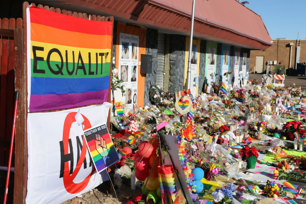 A pride flag reading "Equality" and hundreds of items adorn the closed entrance of an LGBTQ club.
