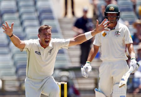 New Zealand's Tim Southee (L) appeals unsuccessfully for LBW to dismiss Australia's Joe Burns during the first day of the second cricket test match at the WACA ground in Perth, Western Australia, November 13, 2015. REUTERS/David Gray