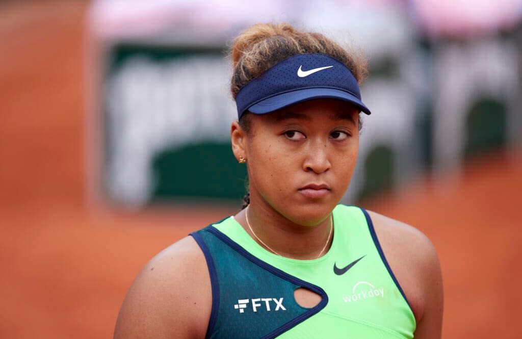 Naomi Osaka of Japan looks on against Amanda Anisimova of United States in their first round match during day two of the 2022 French Open at Roland Garros on May 23, 2022 in Paris, France. (Photo by Tnani Badreddine/Quality Sport Images/Getty Images)