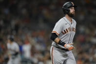 San Francisco Giants' Brandon Belt draws a walk with the bases loaded during the ninth inning of the team's baseball game against the San Diego Padres, Tuesday, Aug. 9, 2022, in San Diego. (AP Photo/Gregory Bull)