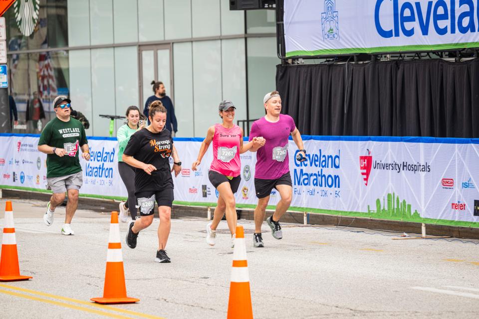 Samantha Salway (pink) completing the Cleveland Marathon with her husband, Ben, on Saturday, May 18, 2024.