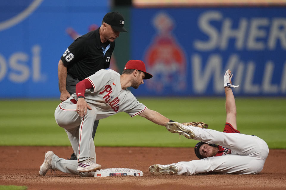 Cleveland Guardians' Myles Straw, right, is tagged out by Philadelphia Phillies shortstop Trea Turner at second base on an attempted steal in the seventh inning of a baseball game Saturday, July 22, 2023, in Cleveland. (AP Photo/Sue Ogrocki)