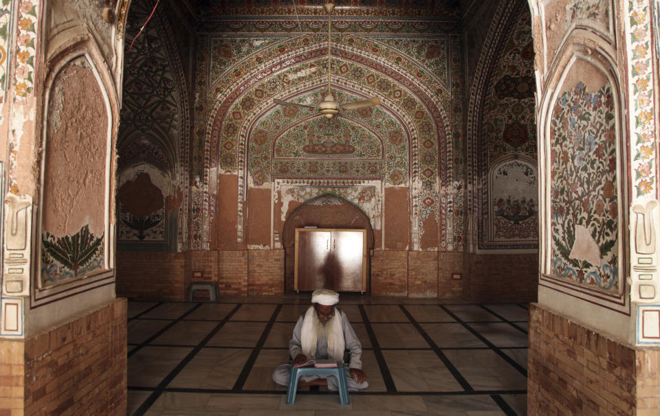 A Pakistani Muslim reads the Quran ahead of Ramadan at a mosque ahead of the upcoming Muslim fasting month of Ramadan, in Peshawar, Pakistan, Saturday, April 2, 2022. (AP Photo/Muhammad Sajjad)