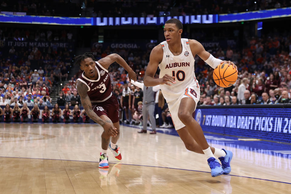 Auburn forward Jabari Smith drives the ball after getting past Texas A&M guard Quenton Jackson during the SEC tournament. Auburn is a No. 2 seed in the men's NCAA tournament, and Smith is a top NBA draft prospect. (Peter Joneleit/Icon Sportswire via Getty Images)