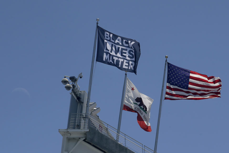 A Black Lives Matter flag flies at Levi's Stadium, the NFL football home of the San Francisco 49ers, in Santa Clara, Calif., Thursday, June 25, 2020. (AP Photo/Jeff Chiu)