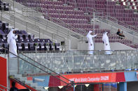 Empty stands are seen at the Khalifa International stadium 20 minutes before the start of competitions during the World Athletics Championships Friday, Sept. 27, 2019, in Doha, Qatar. (AP Photo/Martin Meissner)
